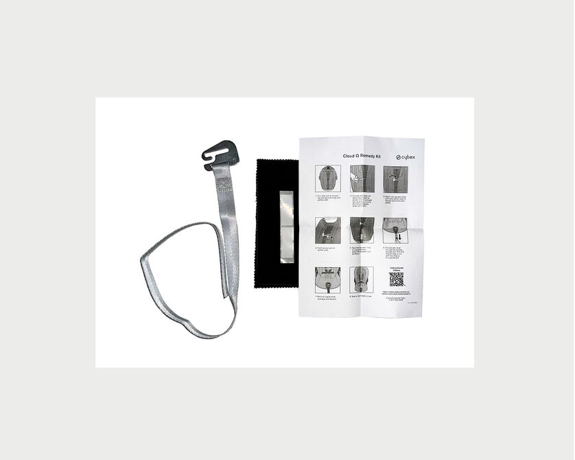 A set including a grey strap, a black cloth, and an illustrated manual.