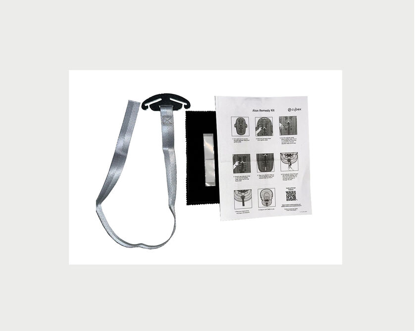 A repair kit featuring a grey strap, a black fabric piece, and an instruction sheet with illustrations.
